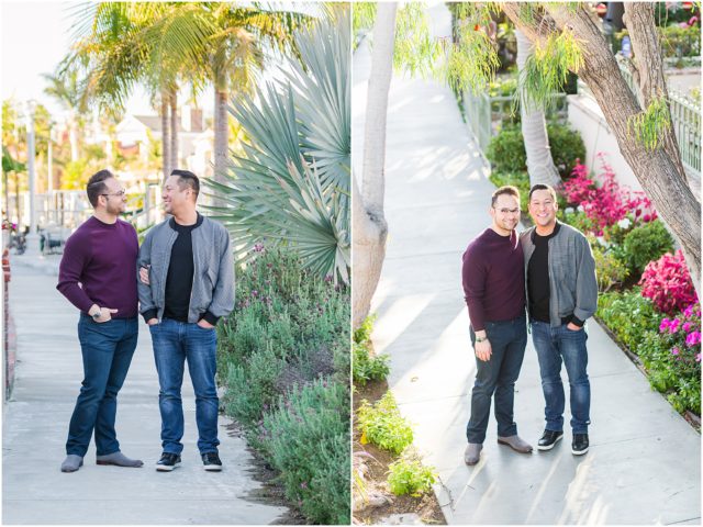 Two happy grooms posing for windy & sunny engagement session in the canals in Long Beach, CA
