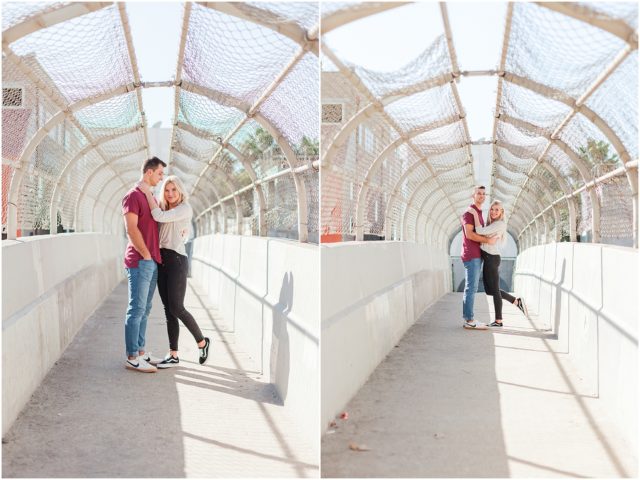 Newly engaged couple posing for their surprise beach engagement session in Santa Monica on PCH