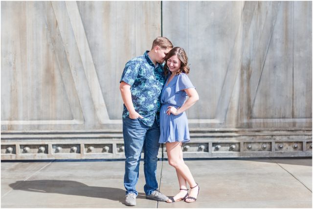 Couple posing for engagement session  in Galaxy's Edge at Disneyland Park.