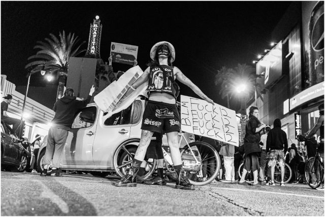 Protestor in Hollywood, holding BLM sign