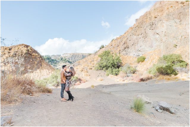 Engagement shoot with engaged couple at the Bronson Bat Caves in the Hollywood Hills with Hollywood sign in background.